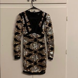 Black and gold sequin dress